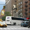 CoachUSA MCI J4500 blocking the intersection of 23 St and 6 Av. Photo taken by Brian Weinberg, 8/5/2004.