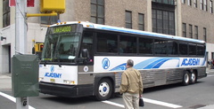 Academy 2003 MCI D4500 Coach 8943 @ Greenwich St &amp; Morris St. Photo taken by Brian Weinberg, 05/05/2003.