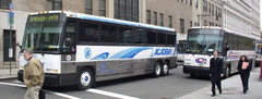 Academy 2001 MCI D4000 Cruiser 8619 @ Greenwich St &amp; Morris St. Photo taken by Brian Weinberg, 05/05/2003.