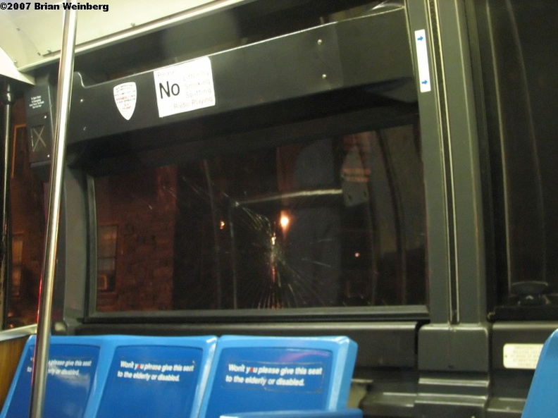 Some guy got pissed that the bus left without him. He knocked on the door and then knocked hard on the window, smashing it. Photo taken by Brian Weinberg, 10/2/2007. IMG_2589f.jpg