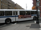 NYCT Orion V 6033 II @ Kingsbridge Ave and 231 St (Bx7). Note that the rear of the bus is painted white instead of black. Photo