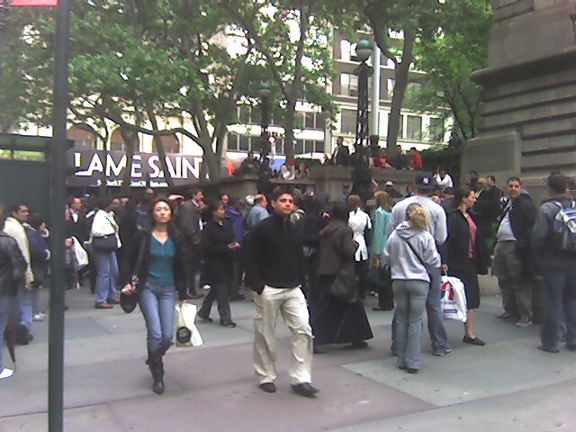Crowd of people waiting outside the subway entrance on the southwest corner of 42 St &amp; 5 Av. Station was closed due to a 12-