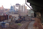 Bombed out caboose and some gondola cars below Sutter Av (L). Photo by Brian Weinberg, 11/27/2002. (172k)