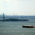 barge passing the Statue of Liberty