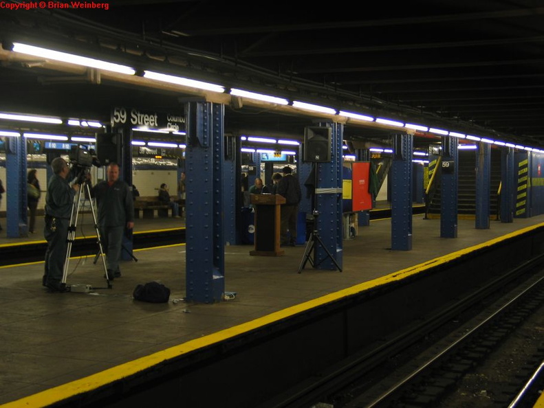 Press conference being set up for the unveiling of the NYC Subway Centennial Commemorative MetroCard series @ 59 St-Columbus Circle, middle platform. Taken by Brian Weinberg, 3/2/2004. IMG_9246.jpg