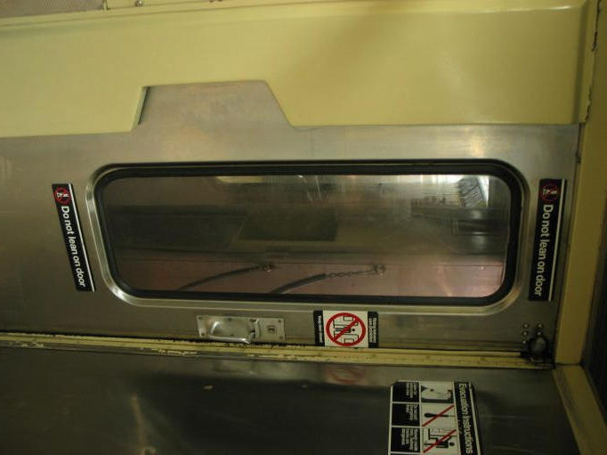 Interior of R-40 4253 @ 59 St-Columbus Circle (B). Note the rubber seal around the storm door window and the lack of a metal fra