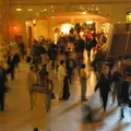 Grand Central Terminal main waiting room. Close up of still figures amongst the craziness. Photo taken from the west staircase.