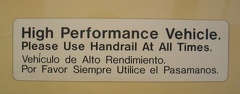 &quot;High Performance Vehicle. Please Use Handrail At All Times&quot; sign in San Diego Trolley Siemens-Duwag LRV #2004 @ Sante