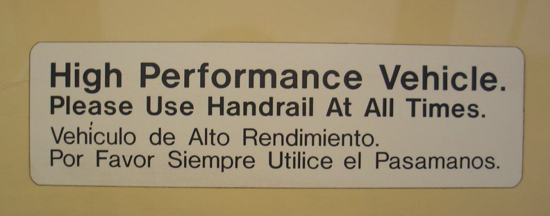&quot;High Performance Vehicle. Please Use Handrail At All Times&quot; sign in San Diego Trolley Siemens-Duwag LRV #2004 @ Sante