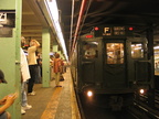 R-1 100 @ 71 St - Continental Av (in service on the F line / Centennial Celebration Special). Note the man with his hands on his
