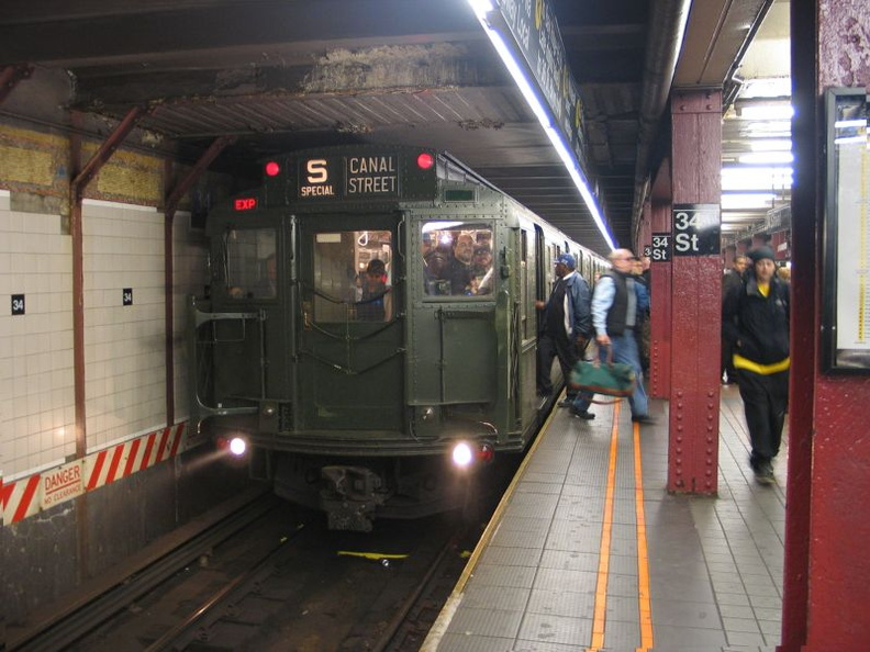 R-1 100 @ 34 St - Herald Square (R/W). Museum train is running in-service. Photo taken by Brian Weinberg, 10/28/2004.
