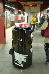 5 Av - Bryant Park (7). Note the newspapers stuck to the freshly painted garbage can. By the next day, it was repainted and the