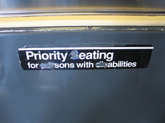 Sign reads: Priority eating for sons with abilities. On an R-42.