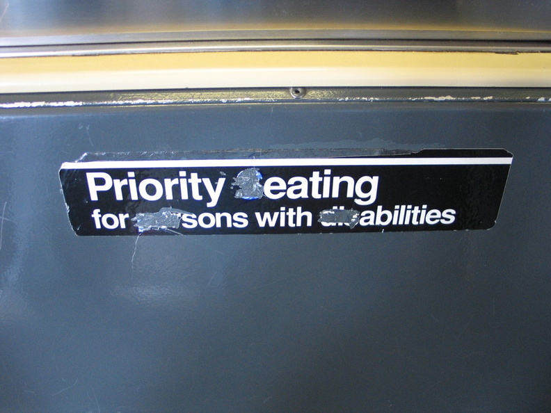 Sign reads: Priority eating for sons with abilities. On an R-42. IMG_3569.jpg
