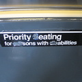 Sign reads: Priority eating for sons with abilities. On an R-42.