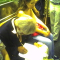 This guy that does pencil drawings of people on the subway (on a 3 train). Photo taken by Brian Weinberg, 9/14/2005.