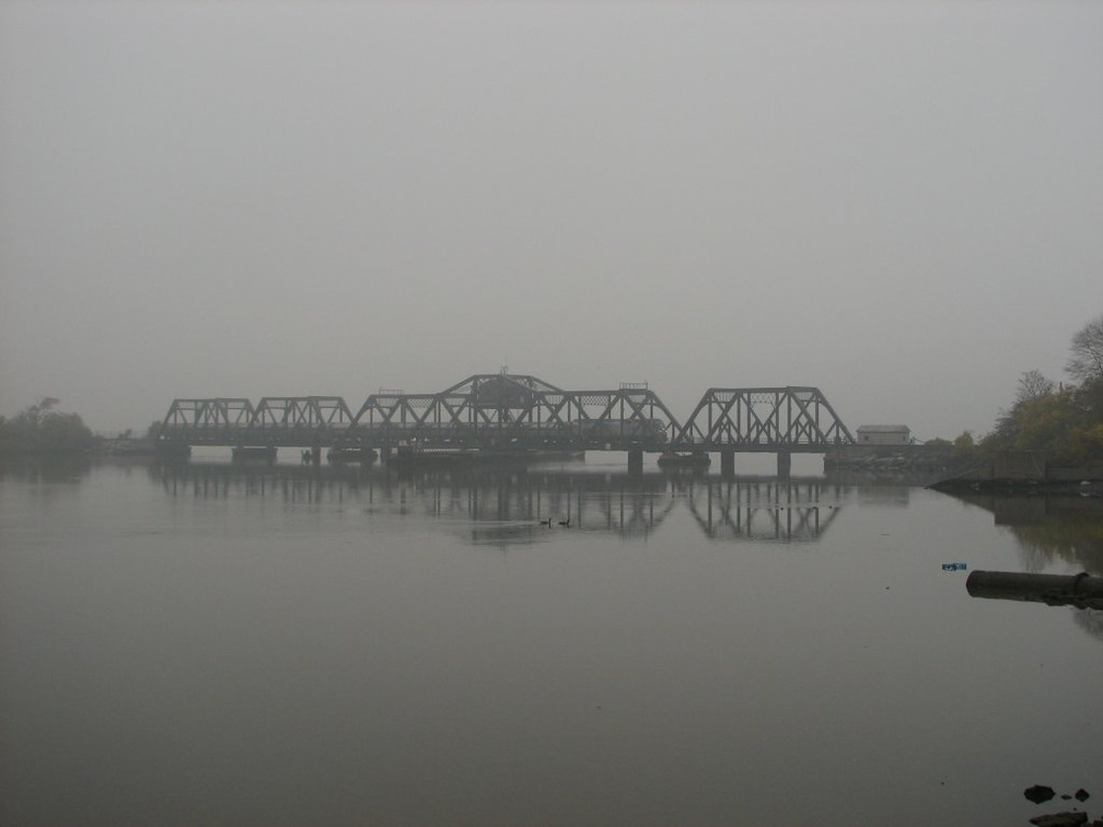 Amtrak P32DM-AC 717 (Train #71) @ Spuyten Duyvil Swing Bridge (Inwood Movable Bridge). Photo taken by Brian Weinberg, 11/6/2005.