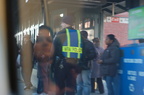 Small crowd on the platform @ Harlem - 125th Street. Photo taken by Brian Weinberg, 12/21/2005.