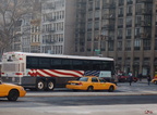 NYCT MCI Cruiser 2185 @ 23 St (X28). This is the 9-11-01 bus. Photo taken by Brian Weinberg, 1/25/2006.