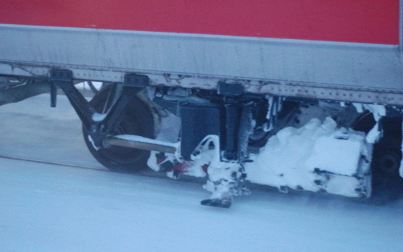 MNCR / CDOT M2 @ Harlem - 125th Street. Detail of truck and third rail shoe. Photo taken by Brian Weinberg, 2/13/2006.