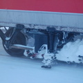 MNCR / CDOT M2 @ Harlem - 125th Street. Detail of truck and third rail shoe. Photo taken by Brian Weinberg, 2/13/2006.