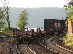 Tail end of freight train @ Spuyten Duyvil (MNCR Hudson Line). Photo taken by Brian Weinberg, 5/17/2006.