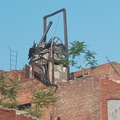 Run-down building near the Harlem-125th Street MNCR station. Is that an old elevator on top? Photo taken by Brian Weinberg, 6/30