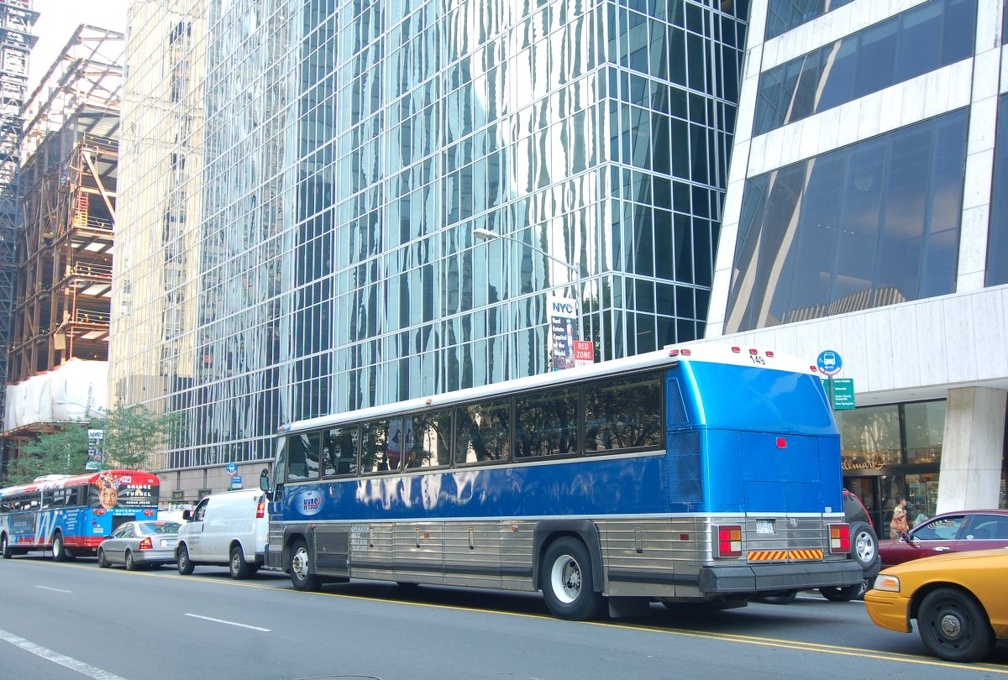 New York Airport Service MCI 102-A2 149 @ 42 St mid-block between 5 Av and 6 Av. Photo taken by Brian Weinberg, 6/30/2006.