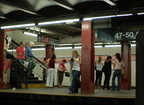 Passengers @ 47-50 Sts - Rockefeller Center (F/V) - downtown platform. Photo taken by Brian Weinberg, 8/4/2006.