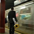 Sunflower man and R-68 2897 @ 47-50 Sts - Rockefeller Center (D). Photo taken by Brian Weinberg, 8/4/2006.