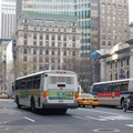 Orion I 8829 and NYCT RTS 9214 @ 5 Av & 42 St. Photo taken by Brian Weinberg, 11/27/2006.