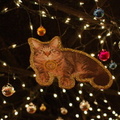 Token, the cat that lives at the Transit Museum, seen here pictured on a decoration hanging from the ceiling of the Transit Muse