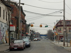 In the distance, the Staten Island North Shore right-of-way crossing over Port Richmond Avenue. Photo looks south. Photo taken b