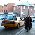 Taxi cab in a bus lane at the Victor Moore Arcade bus station @ 74 St - Broadway and/or Jackson Heights-Roosevelt Avenue (7/E/F/