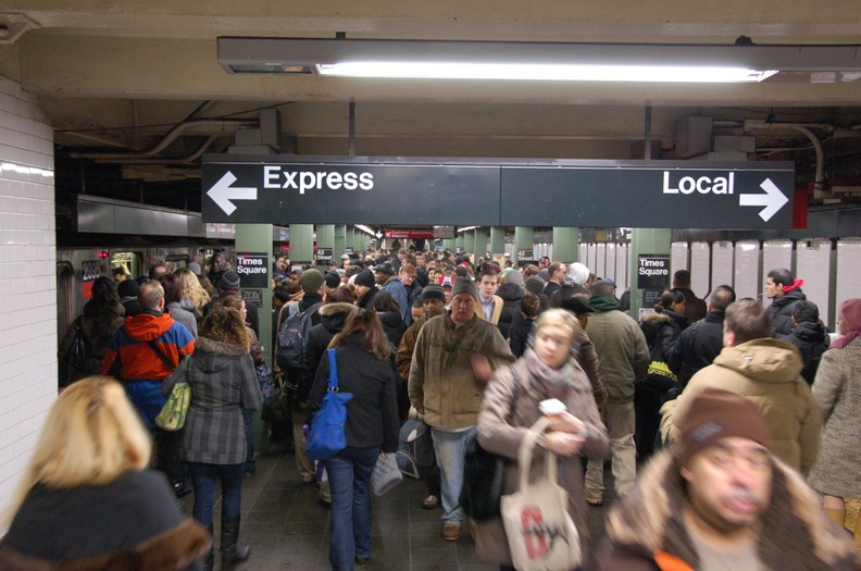 Crowded conditions on the IRT downtown platform @ Times Sq - 42 St (1/2/3). Note the (1) on the express track making express stops to 14 St. Photo taken by Brian Weinberg, 2/22/2008. DSC_0309.jpg