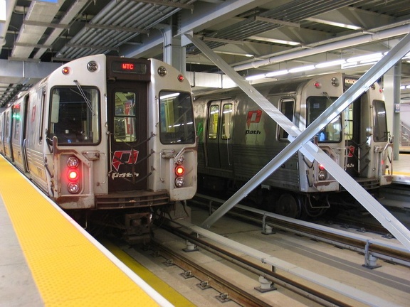 PATH PA-4 869 side by side with PA-4 886 @ WTC. Note the experimental LED destination sign above the storm door. Photo taken by