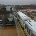 View from a window of the Federal Circle station, looking at an outbound train leaving (from here can head to either Jamaica or