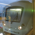 Head on shot of an outbound AirTrain stopped at the Federal Circle station.