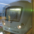 Head on shot of an outbound AirTrain stopped at the Federal Circle station.