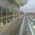 View out the HUGE railfan window of an outbound AirTrain stopped at the Federal Circle station.