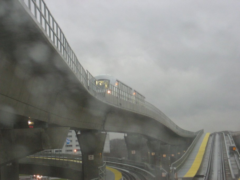 View out the HUGE railfan window of a Jamaica bound AirTrain climbing the hill after just leaving at the Federal Circle station. IMG_7311.jpg