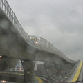 View out the HUGE railfan window of a Jamaica bound AirTrain climbing the hill after just leaving at the Federal Circle station.