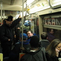 Woman who had to call her friend to tell her she was on the first (D) train and it had a ton of train buffs on it