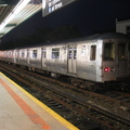R-44 5228 @ Rockaway Park (A / S). This car has a stainless steel band replacing the usually painted carbon steel band. Photo ta