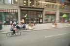 Bicyclist on 5 Av as seen from the M2 bus. Photo taken by Brian Weinberg, 6/29/2006.