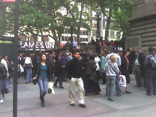 Crowd of people waiting outside the subway entrance on the southwest corner of 42 St &amp; 5 Av. Station was closed due to a 12-