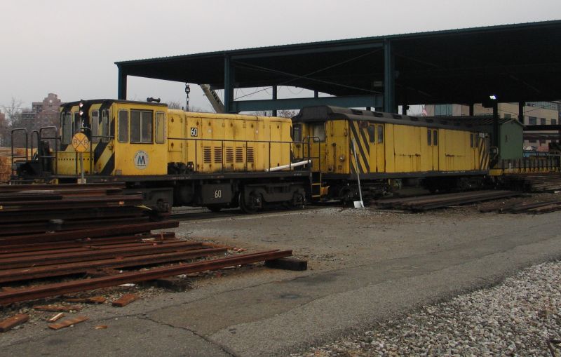 R-43 60 with R-14 5857 (now RD330) @ Westchester Yard. Photo taken by Brian Weinberg, 12/19/2004.