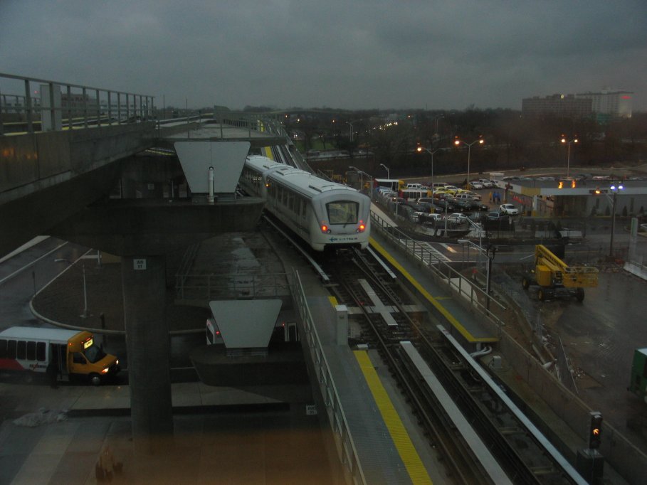 Howard Beach bound AirTrain leaving Federal Circle station.