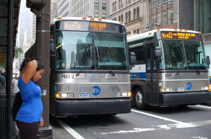 MTA Bus MCI D4501 7425 (ex-NYBS 1803) and MCI D4500CL 3041 @ 42 St &amp; 5 Av. Photo taken by Brian Weinberg, 7/27/2006.