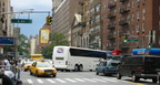 CoachUSA MCI J4500 blocking the intersection of 23 St and 6 Av. Photo taken by Brian Weinberg, 8/5/2004.